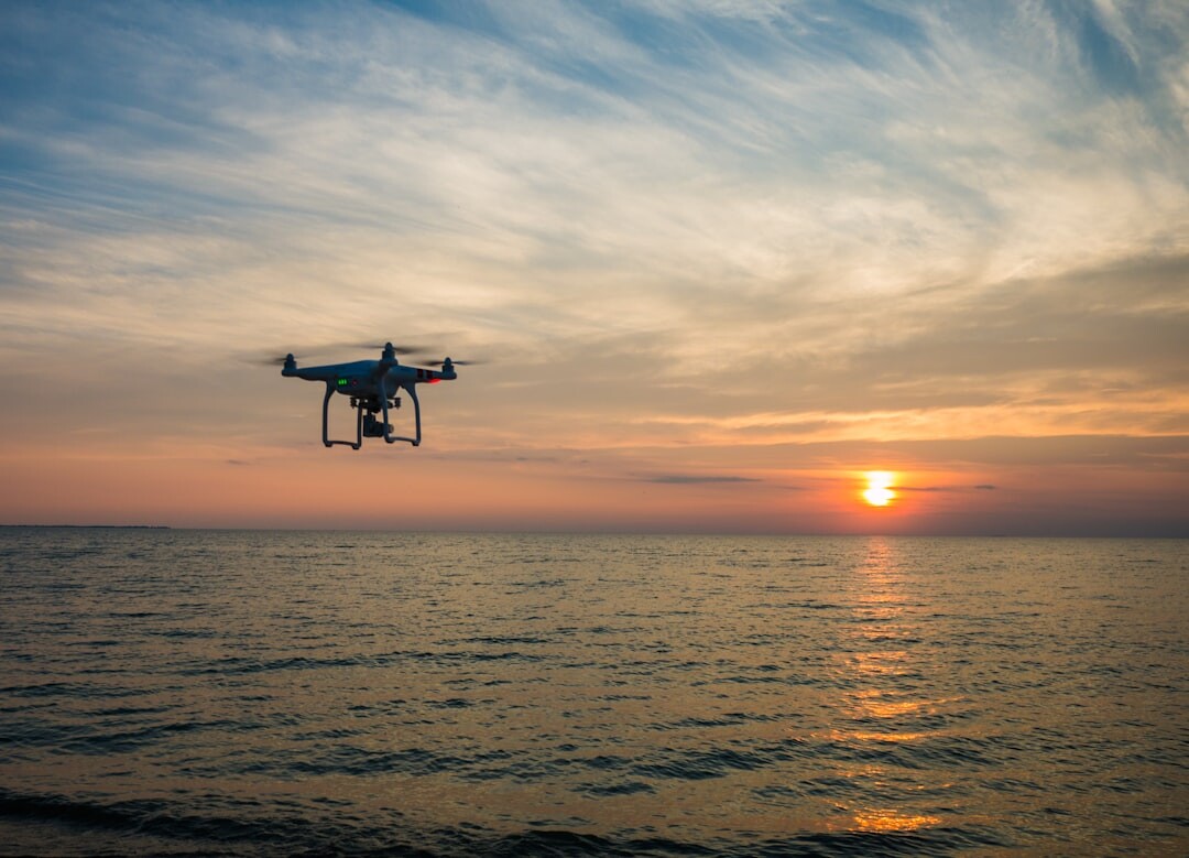 Modern drone flying in sky